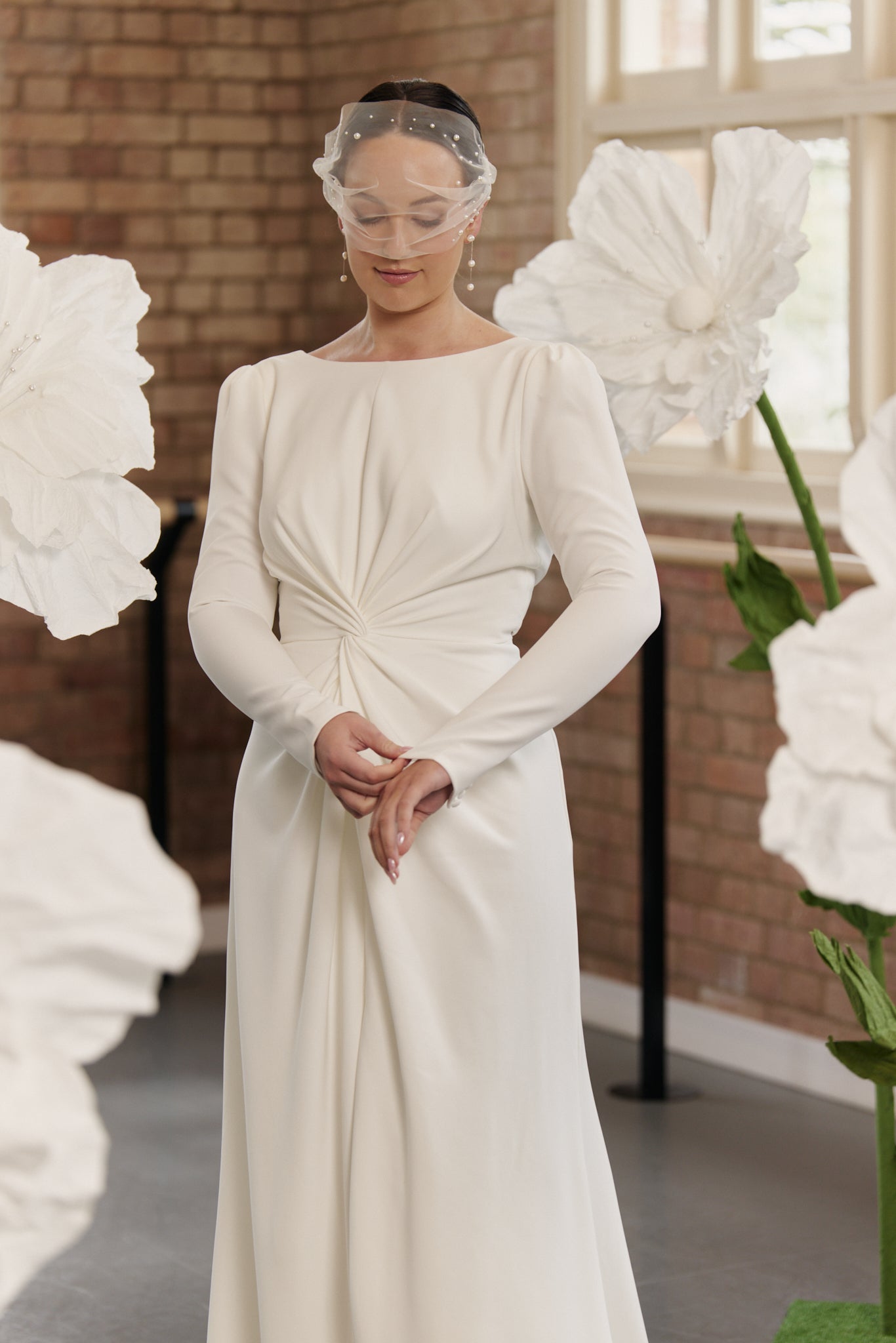 Agnes Wedding Dress, backless, boat neck, front split, long sleeve wedding gown, close view.