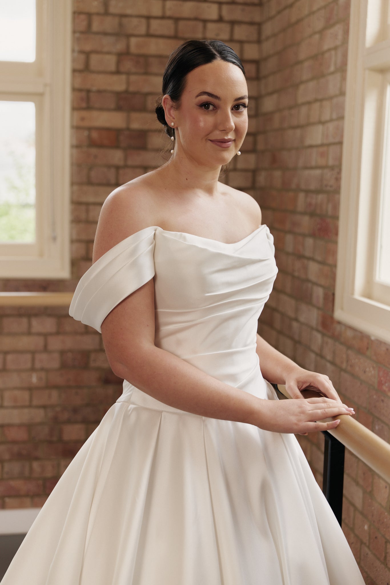Close-up of ruched structured corset bodice on the Antonia wedding dress in satin Mikado, with dropped sleeve