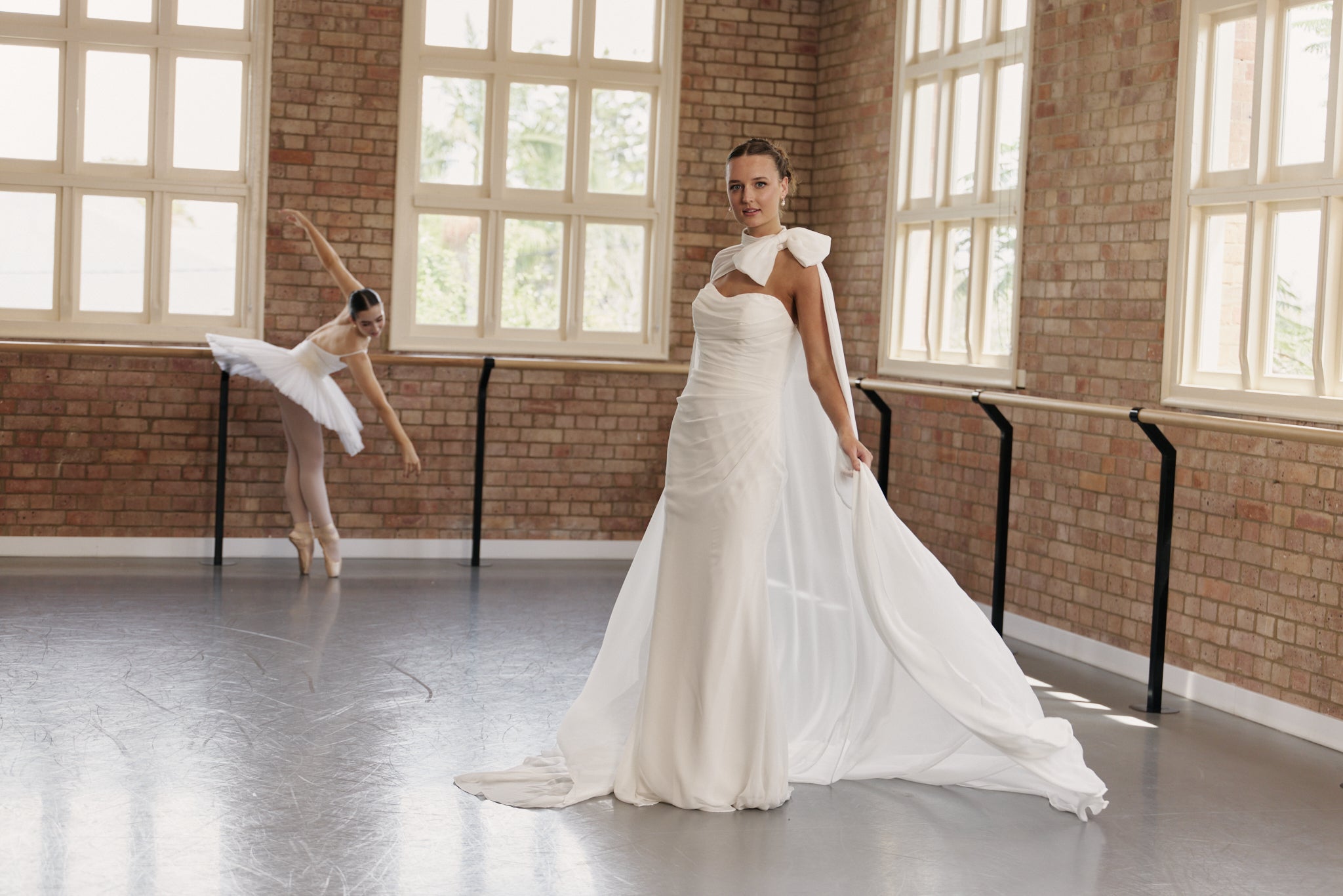 Bride wearing Bridgette strapless mermaid wedding dress in soft chiffon with ruched bodice.