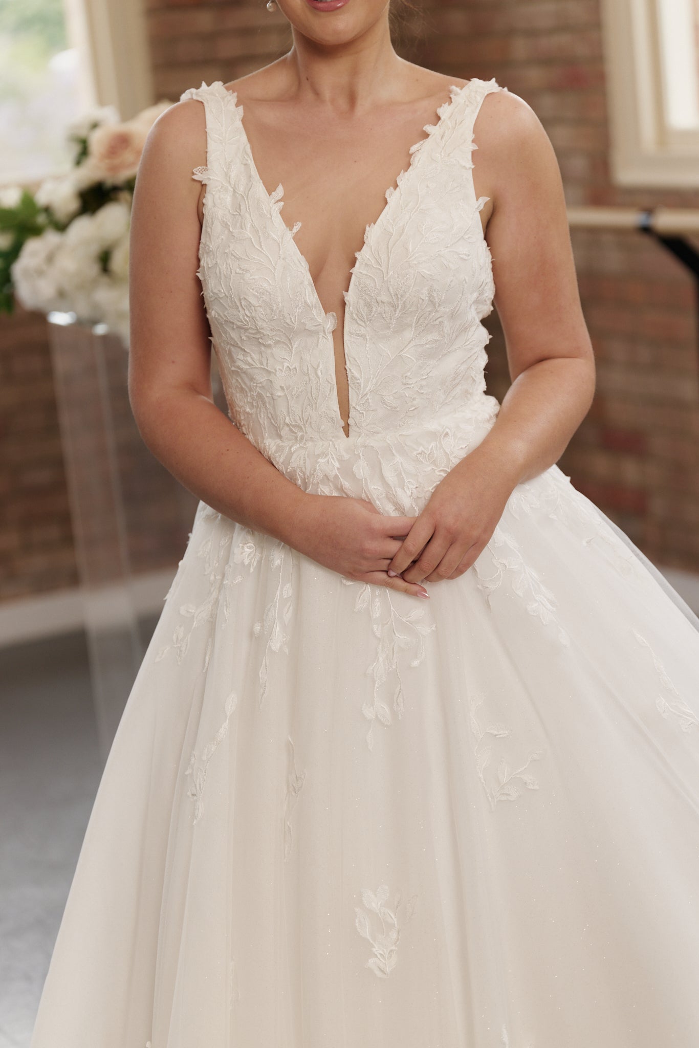 Close-up of embroidered bodice on the Celine V-neck princess ball gown wedding gown.
