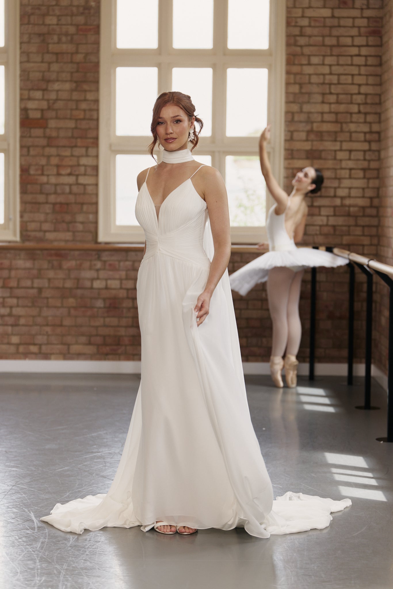 Lightweight chiffon wedding dress with ruched bodice, dropped waist, and floaty gathered skirt.