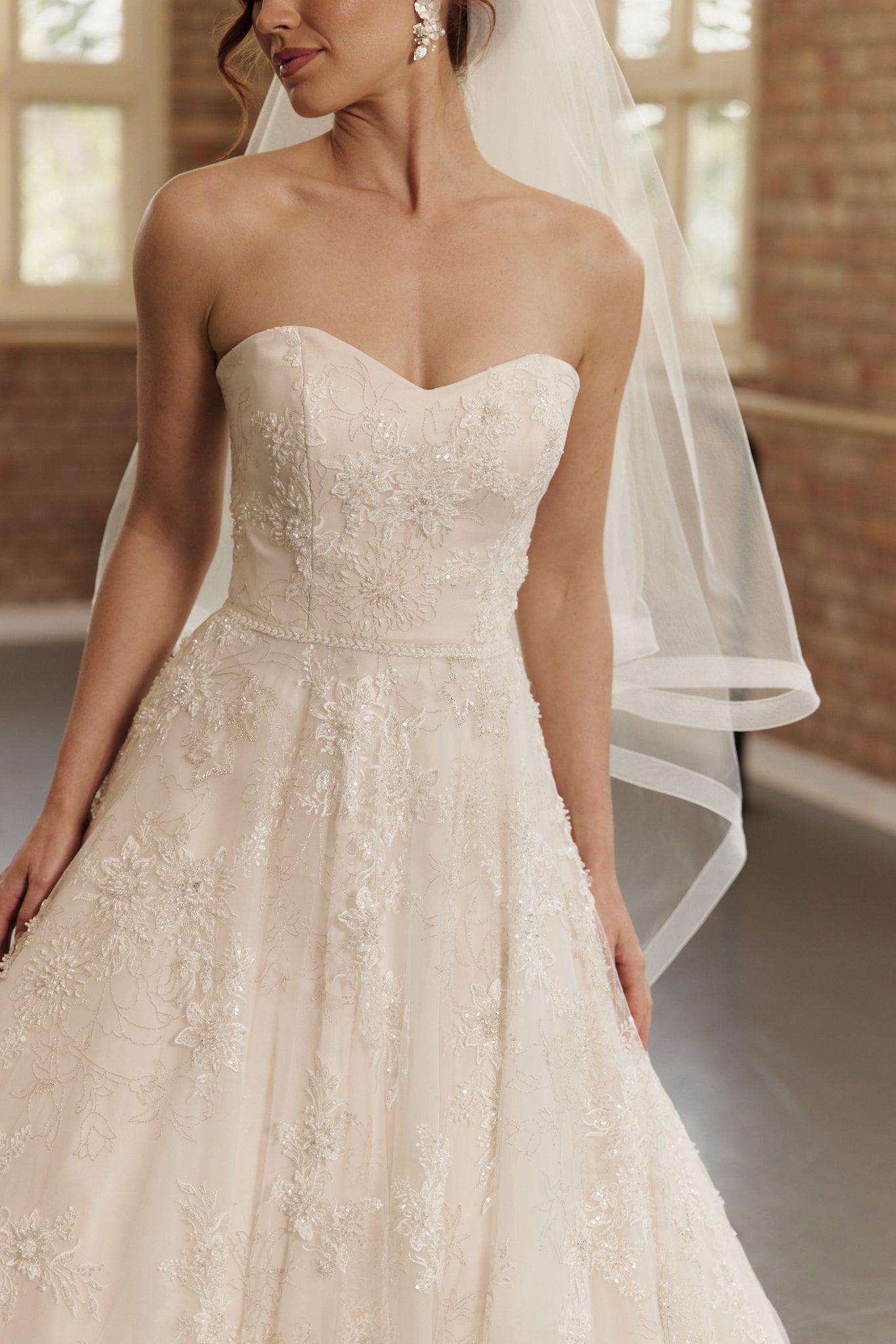Close-up of the Elodie dress with intricate beading and strapless sweetheart neckline detailing.