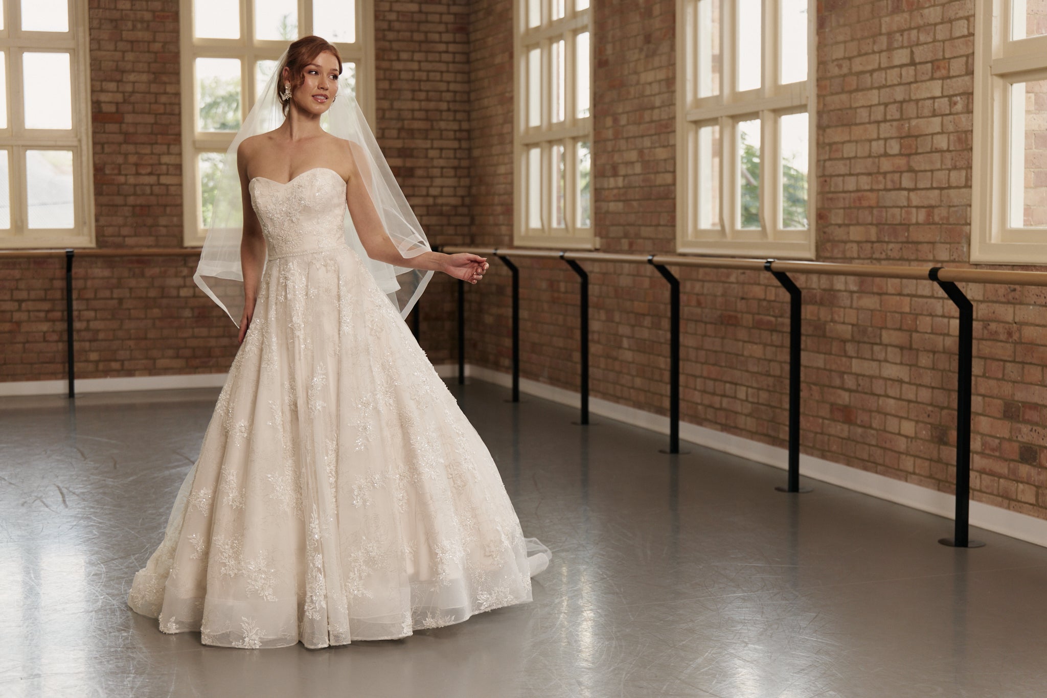 Front view of the Elodie wedding gown with strapless sweetheart neckline, intricate beading, and full princess ball gown skirt.