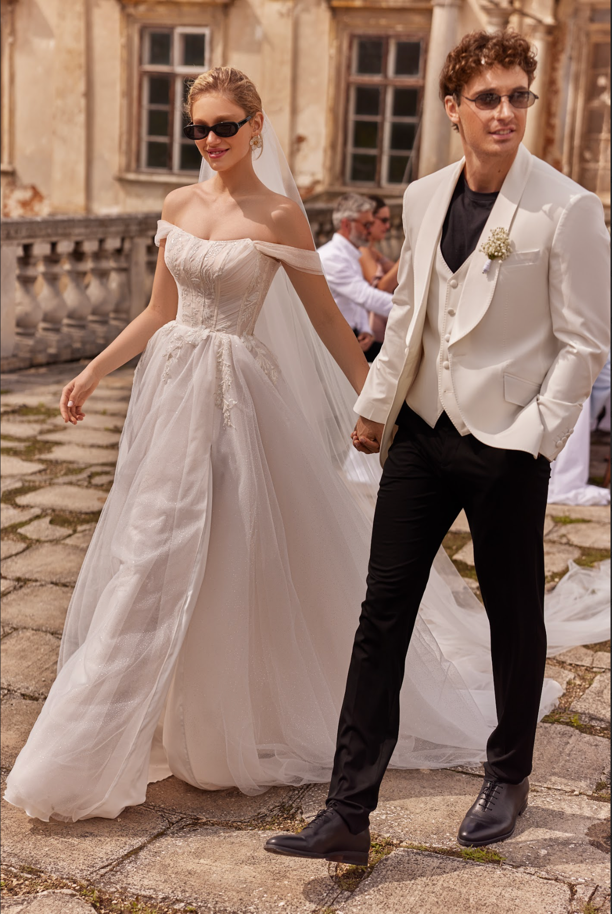 Jennifer Wedding Gown corset bodice, finely pleated draped tulle with delicate beading, wing sleeve, a line to ball gown skirt with split