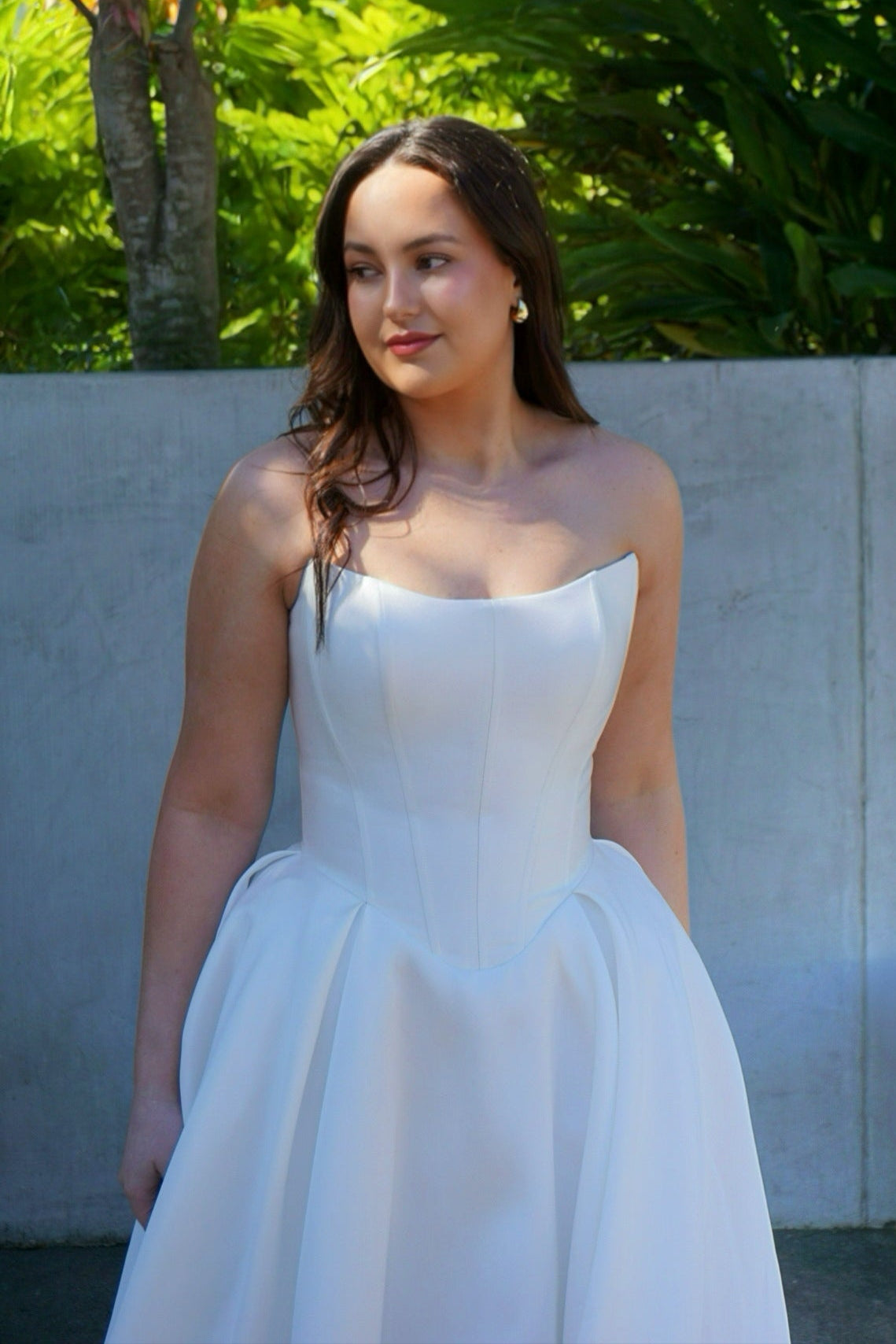 Mackenzie wedding dress with strapless scoop neckline, structured corset bodice, basque waist, and full princess ball gown silhouette.
