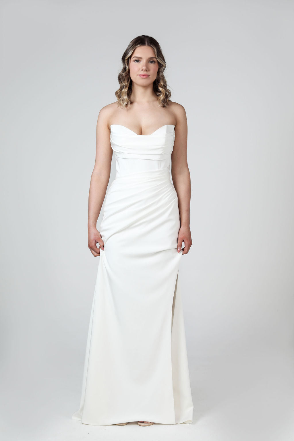 Nova Wedding Dress in stretch crepe, ruched waist and strapless cat's eye neckline.