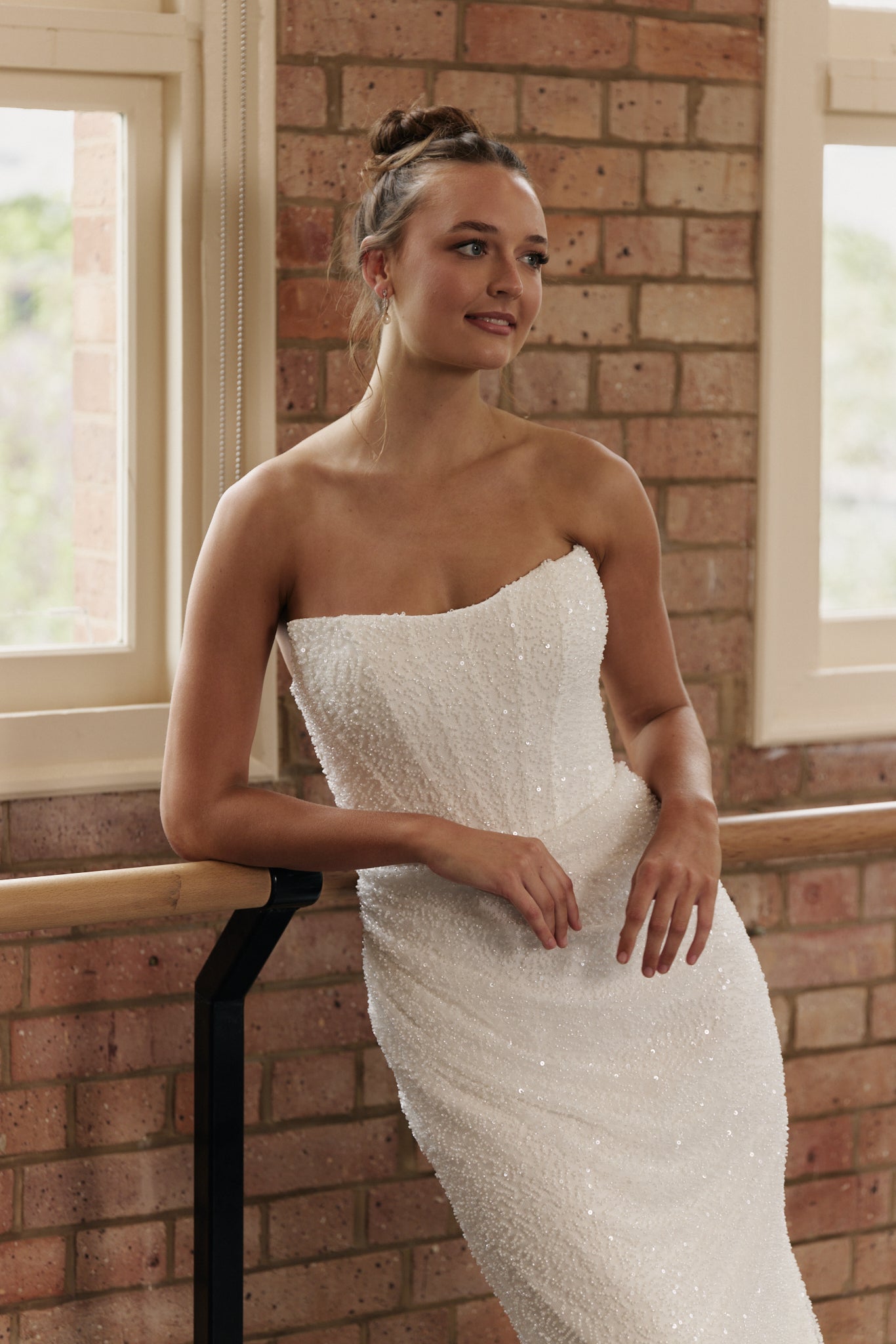 Rebecca strapless mermaid wedding dress with beaded corset, hip ruching, and cats eye neckline.