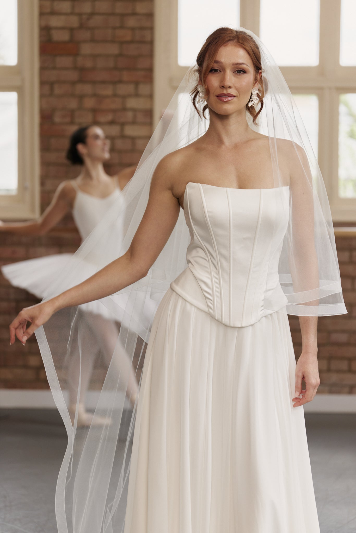 Sleek satin bridal bodice with internal boning, creating a tailored silhouette for the contemporary bride.