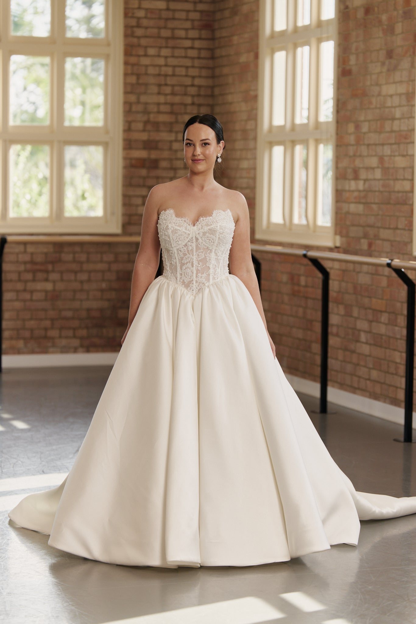 Princess-style ball gown with beaded lace bodice and basque waistline, elegant fairytale bridal dress