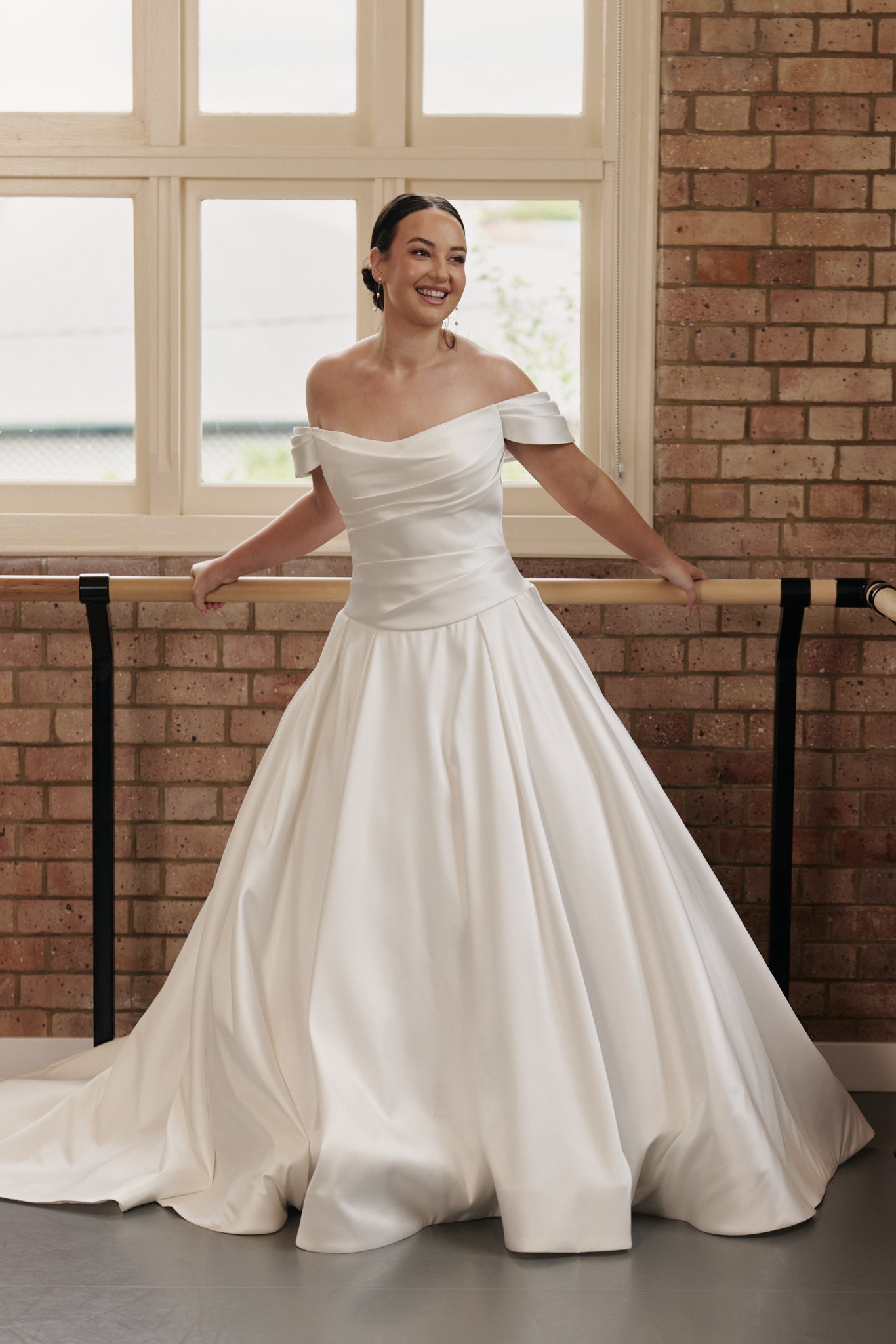 Antonia wedding dress with ruched structured bodice, with sleevelets and dropped waist and full satin Mikado skirt.