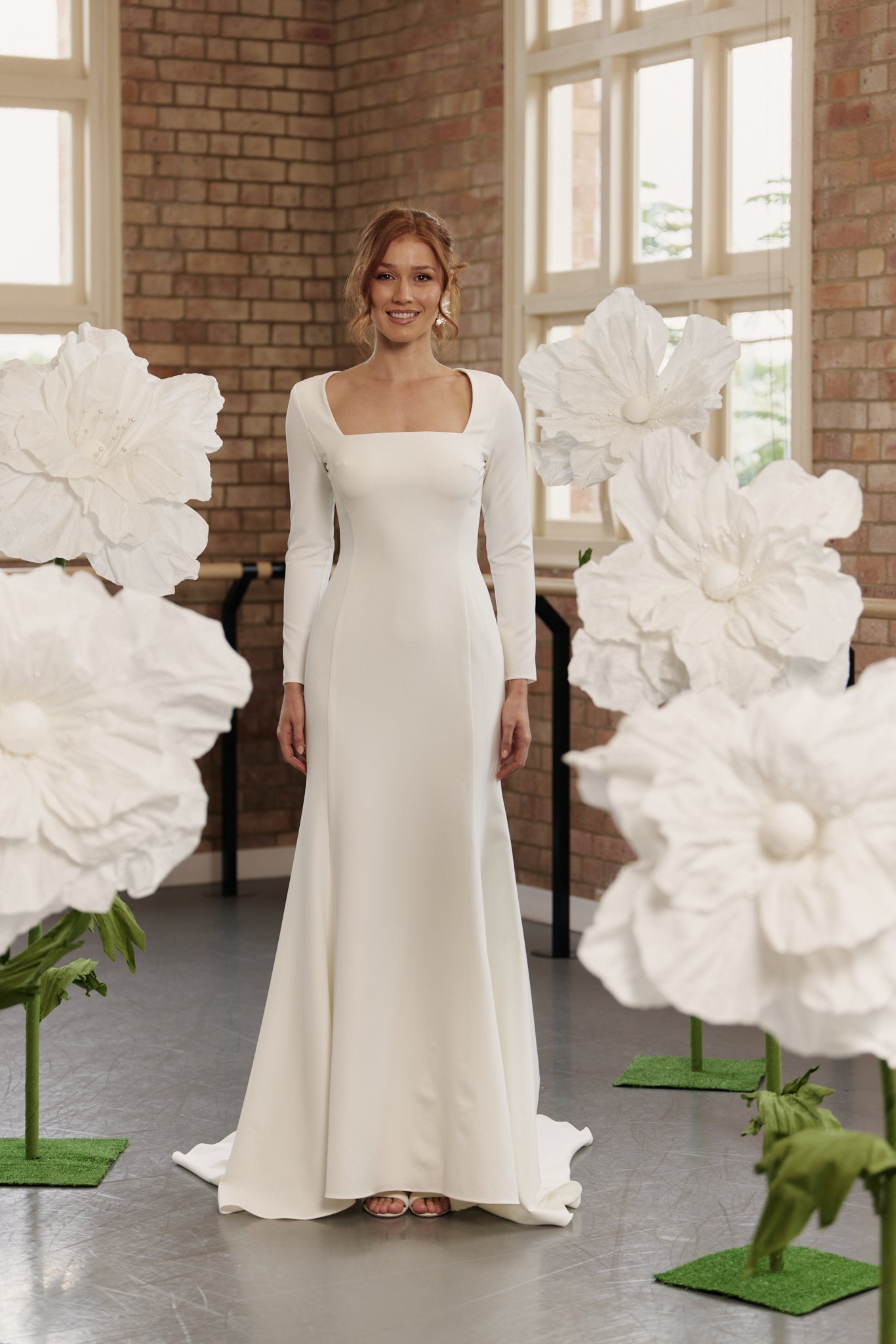 Charlotte wedding dress with square neckline, long sleeves, and mermaid silhouette in soft crepe