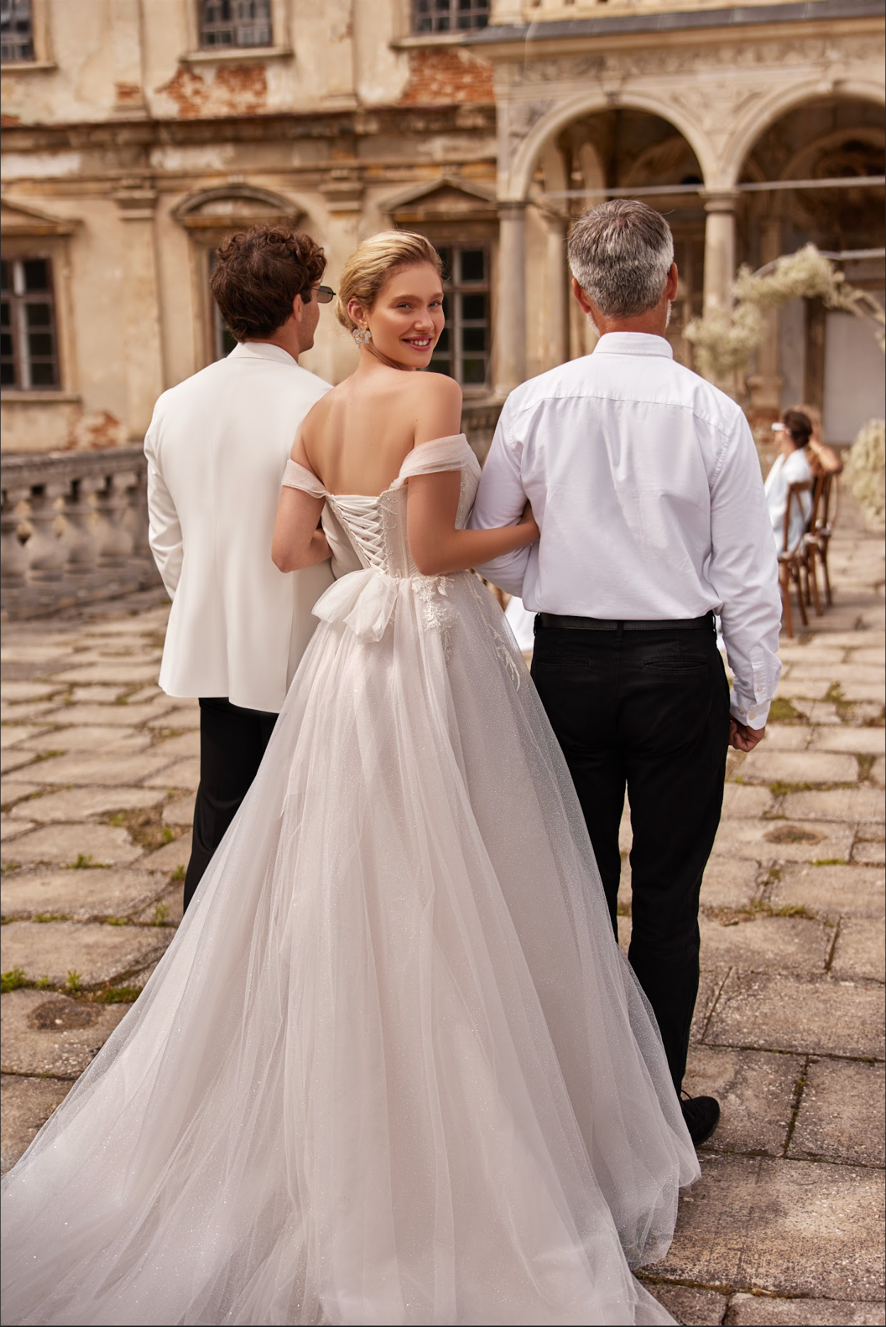 Jennifer Wedding Gown corset bodice, finely pleated draped tulle with delicate beading, wing sleeve, a line to ball gown skirt with split
