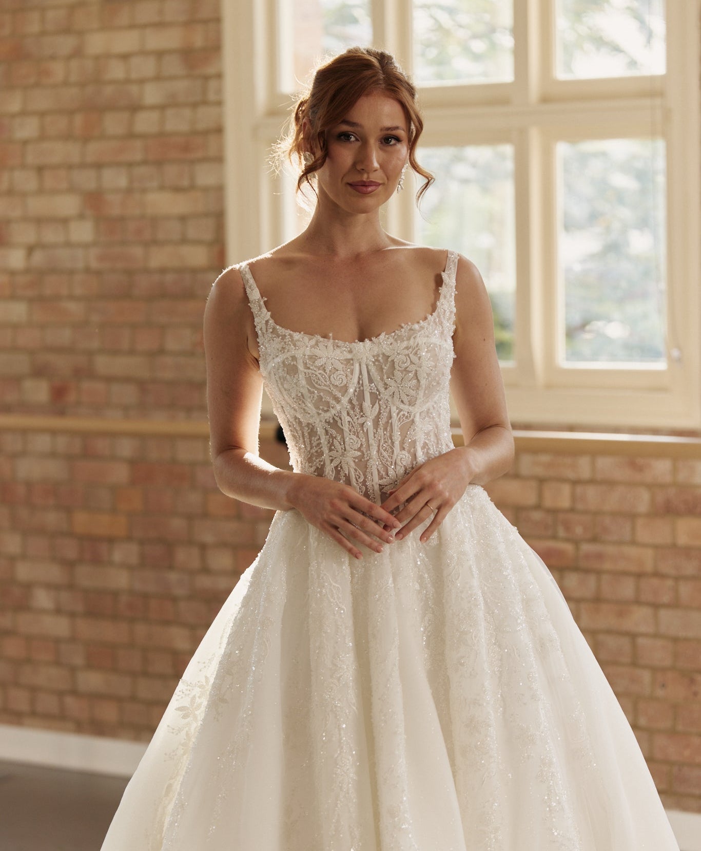 Ophelia bridal gown featuring elegant beaded corset bodice, layered organza ball skirt, and intricate lace beading