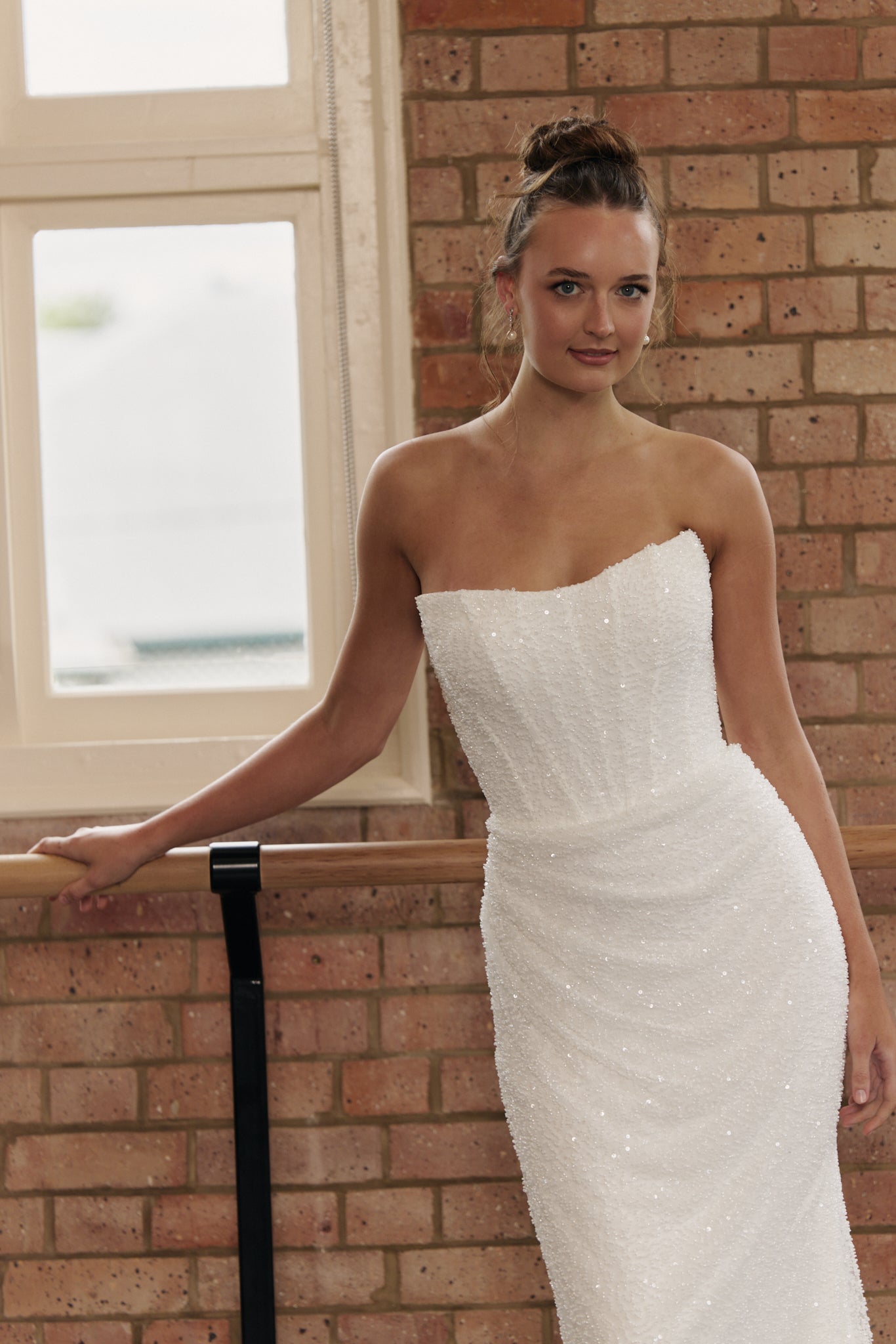Close-up of the Rebecca Dress fully beaded gown with corset bodice and cats eye neckline detailing.