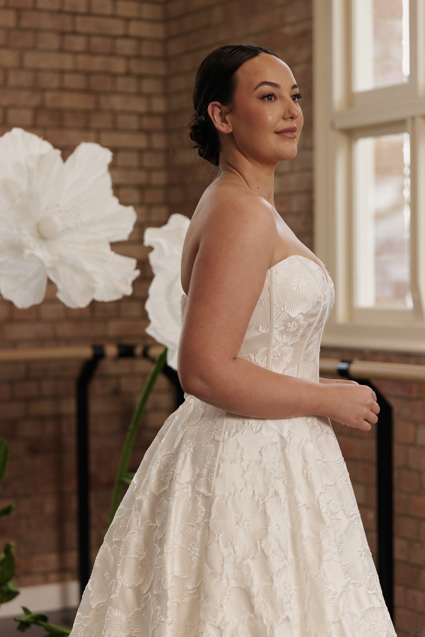 Side profile of the Savannah gown highlighting the fitted sweetheart bodice and flowing princess-style skirt.
