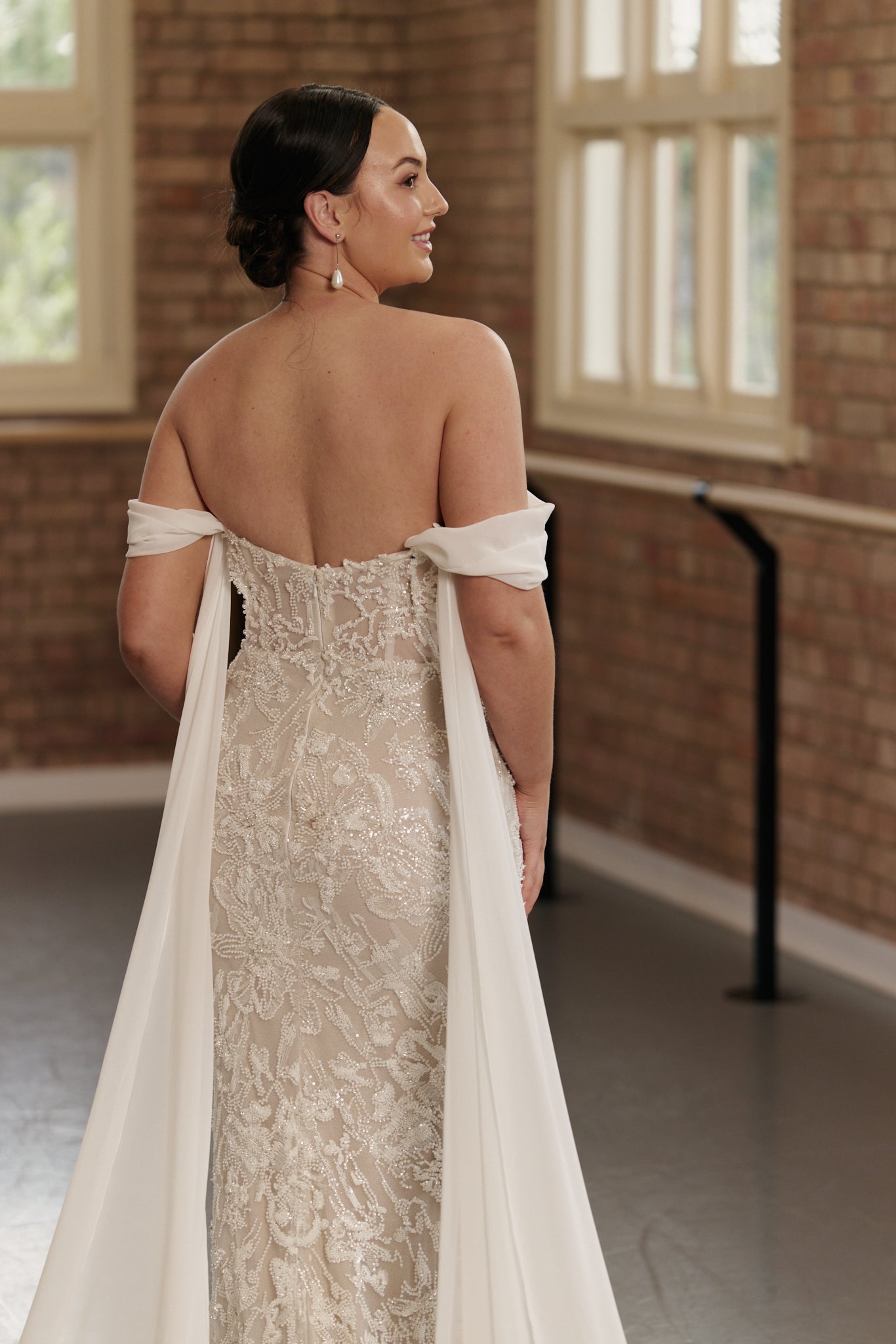 Fitted Anastasia mermaid wedding dress featuring flowing georgette sleeves and intricate beadwork