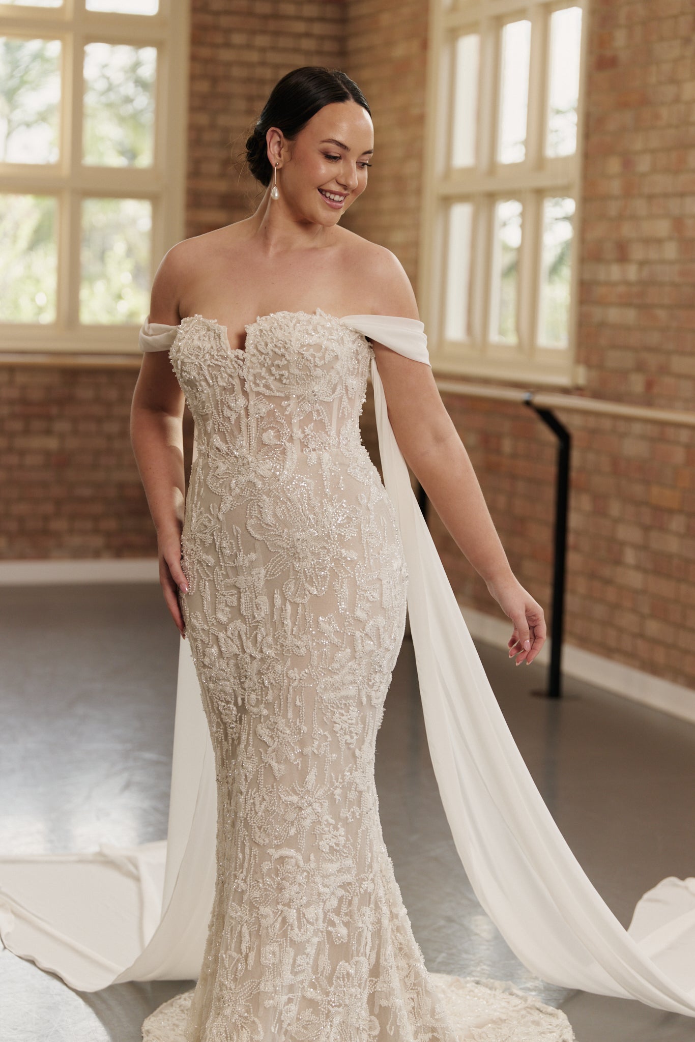 Fitted Anastasia wedding gown featuring flowing georgette sleeves and intricate beadwork for formal occasions.