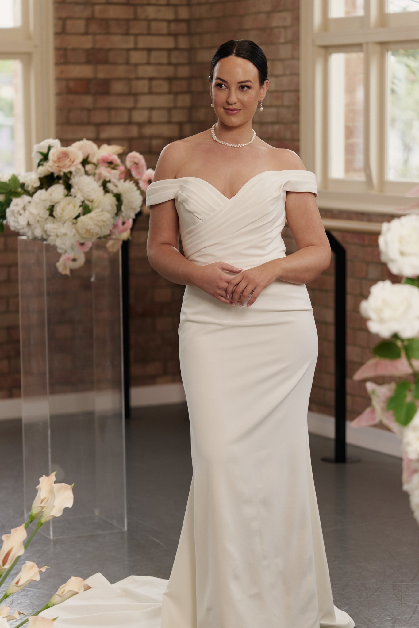 Violet gown elegant off-shoulder mermaid wedding dress with pleated cross-body detailing in smooth crepe.