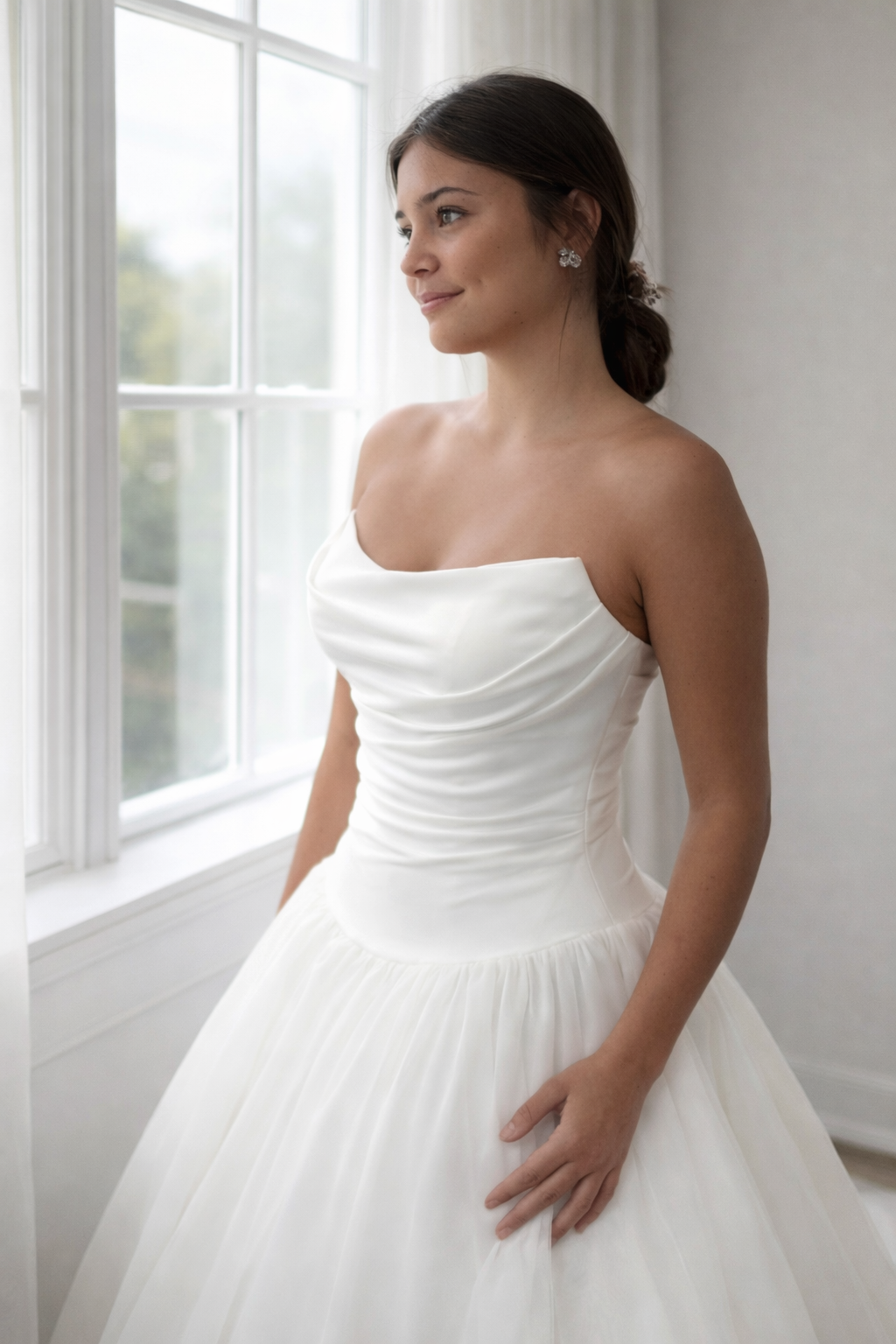 Lara wedding dress, strapless with ruching and dropped waist organza skirt.