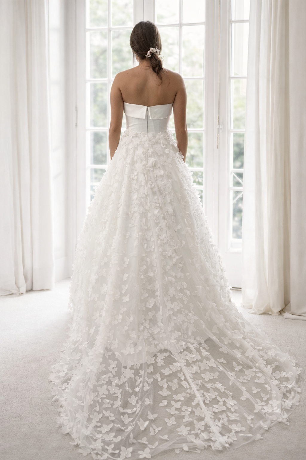 Petals wedding dress with classic straight strapless bodice and 3-D petal tulle skirt.